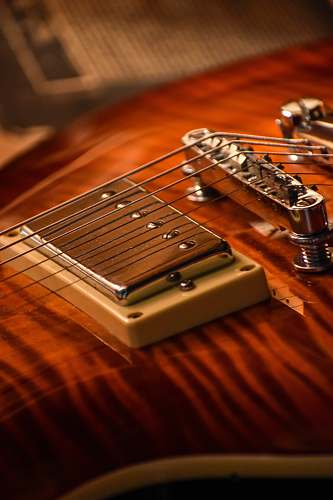 leisure activities close-up photo of brown electric guitar musical instrument